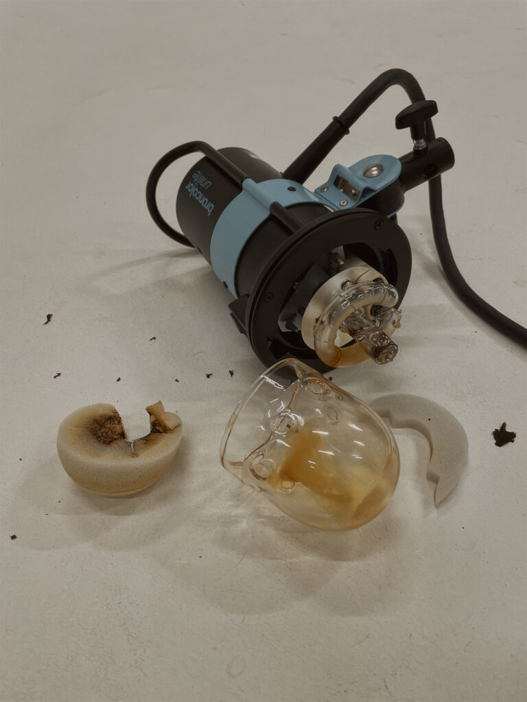 broken flash head on the floor. sustainable photography is taking care of your equipment.